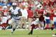 GLENDALE, AZ - SEPTEMBER 15: Wide receiver Calvin Johnson #81 of the Detroit Lions runs with the football after a reception past strong safety Yeremiah Bell #37 of the Arizona Cardinals during the NFL game at the University of Phoenix Stadium on Septembe