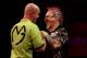 LONDON, ENGLAND - JANUARY 01: Peter Wright of Scotland congratulates Michael van Gerwen of The Netherlands during the final of the Ladbrokes.com World Darts Championships at Alexandra Palace on January 1, 2014 in London, England. (Photo by Ben Hoskins/Ge
