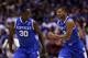 INDIANAPOLIS, IN - MARCH 30: Aaron Harrison #2 of the Kentucky Wildcats celebrates with teammate Julius Randle #30 after defeating the Michigan Wolverines 75 to 72 in the midwest regional final of the 2014 NCAA Men's Basketball Tournament at Lucas Oil St