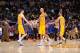 LOS ANGELES, CA - MARCH 25: Ryan Kelly #4, Robert Sacre #50, and Kendall Marshall #12 of the Los Angeles Lakers celebrate during a game against the New York Knicks at Staples Center on March 25, 2014 in Los Angeles, California. NOTE TO USER: User expressl