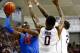 STORRS, CT - DECEMBER 02: Will Yeguete #15 of the Florida Gators puts up a shot in front of Phillip Nolan #0 of the Connecticut Huskies in the first half during the game at Harry A. Gampel Pavilion on December 2, 2013 in Storrs, Connecticut. (Photo by J