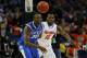 ATLANTA, GA - MARCH 16: Will Yeguete #15 of the Florida Gators knocks the ball away from Julius Randle #30 of the Kentucky Wildcats in the first half during the Championship game of the 2014 Men's SEC Basketball Tournament at Georgia Dome on March 16, 20