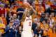 INDIANAPOLIS, IN - MARCH 13: Yogi Ferrell #11 of the Indiana Hoosiers shoots the ball in the game against the Illinois Fighting Illini during the first round of the Big Ten Basketball Tournament at Bankers Life Fieldhouse on March 13, 2014 in Indianapol