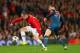 MANCHESTER, ENGLAND - APRIL 01: Toni Kroos of Bayern Muenchen marshalls Wayne Rooney of Manchester United during the UEFA Champions League Quarter Final first leg match between Manchester United and FC Bayern Muenchen at Old Trafford on April 1, 2014 in