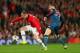 MANCHESTER, ENGLAND - APRIL 01: Toni Kroos of Bayern Muenchen marshalls Wayne Rooney of Manchester United during the UEFA Champions League Quarter Final first leg match between Manchester United and FC Bayern Muenchen at Old Trafford on April 1, 2014 in