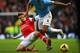 MANCHESTER, ENGLAND - DECEMBER 14: Aaron Ramsey of Arsenal tackles Vincent Kompany of Manchester City during the Barclays Premier League match between Manchester City and Arsenal at Etihad Stadium on December 14, 2013 in Manchester, England. (Photo by R