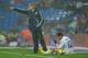 MADRID, SPAIN - JANUARY 10: Head coach Manuel Pellegrini of Real Madrid reacts to his players as Marcelo Vieira sits on the pitch during the La Liga match between Real Madrid and Mallorca at the Estadio Santiago Bernabeu on January 10, 2010 in Madrid, Sp