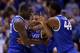 INDIANAPOLIS, IN - MARCH 30: Aaron Harrison #2 of the Kentucky Wildcats celebrates with teammates Julius Randle #30 and Dakari Johnson #44 after defeating the Michigan Wolverines 75 to 72 in the midwest regional final of the 2014 NCAA Men's Basketball To