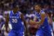 INDIANAPOLIS, IN - MARCH 30: Aaron Harrison #2 of the Kentucky Wildcats celebrates with teammate Julius Randle #30 after defeating the Michigan Wolverines 75 to 72 in the midwest regional final of the 2014 NCAA Men's Basketball Tournament at Lucas Oil St