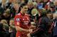 LIVERPOOL, ENGLAND - APRIL 11: Andy Carroll of Liverpool is congratulated by his Manager Kenny Dalglish as he is substituted during the Barclays Premier League match between Liverpool and Manchester City at Anfield on April 11, 2011 in Liverpool, England