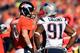 DENVER, CO - JANUARY 19: Peyton Manning #18 of the Denver Broncos talks with Jamie Collins #91 of the New England Patriots during the AFC Championship game at Sports Authority Field at Mile High on January 19, 2014 in Denver, Colorado. (Photo by Jamie S