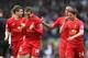 LIVERPOOL, ENGLAND - MARCH 30: Jordan Henderson of Liverpool celebrates with his team-mates after scoring the fourth goal during the Barclays Premier League match between Liverpool and Tottenham Hotspur at Anfield on March 30, 2014 in Liverpool, England.