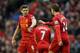 LIVERPOOL, ENGLAND - FEBRUARY 23: Jordan Henderson of Liverpool celebrates scoring his team's fourth goal with his team-mate Steven Gerrard during the Barclays Premier League match between Liverpool and Swansea City at Anfield on February 23, 2014 in Liv