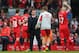 LIVERPOOL, ENGLAND - MARCH 30: Liverpool Manager Brendan Rodgers congratulates Jon Flanagan and Steven Gerrard of Liverpool at the end of the Barclays Premier League match between Liverpool and Tottenham Hotspur at Anfield on March 30, 2014 in Liverpool,