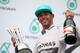 KUALA LUMPUR, MALAYSIA - MARCH 30: Race winner Lewis Hamilton of Great Britain and Mercedes GP celebrates on the podium after the Malaysia Formula One Grand Prix at the Sepang Circuit on March 30, 2014 in Kuala Lumpur, Malaysia. (Photo by Clive Mason/Ge