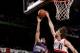 PORTLAND, OR - APRIL 4: Ish Smith #3 of the Phoenix Suns shoots against Robin Lopez #42 of the Portland Trail Blazers on April 4, 2014 at the Moda Center Arena in Portland, Oregon. NOTE TO USER: User expressly acknowledges and agrees that, by downloading