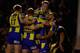WARRINGTON, ENGLAND - SEPTEMBER 26: Simon Grix of Warrington is mobbed by teammates after scoring his try durng the Super League Qualifying Semi Final between Warrington Wolves and Huddersfield Giants at The Halliwell Jones Stadium on September 26, 2013