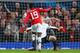 Welbeck attempts to chip ball over Neuer