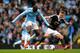 MANCHESTER, ENGLAND - APRIL 05: Yaya Toure of Manchester City is challenged by James Ward-Prowse of Southampton during the Barclays Premier League match between Manchester City and Southampton at Etihad Stadium on April 5, 2014 in Manchester, England. (