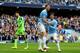 MANCHESTER, ENGLAND - APRIL 05: Edin Dzeko (C) of Manchester City is congratulated by teammate David Silva (R) after scoring his team's third goal as dejected goalkeeper Paulo Gazzaniga of Southampton looks on during the Barclays Premier League match bet