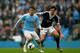MANCHESTER, ENGLAND - APRIL 05: David Silva of Manchester City is challenged by Jack Cork of Southampton during the Barclays Premier League match between Manchester City and Southampton at Etihad Stadium on April 5, 2014 in Manchester, England. (Photo b