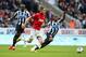 NEWCASTLE UPON TYNE, ENGLAND - APRIL 05: Adnan Januzaj of Manchester United and Vurnon Anita of Newcastle United compete for the ball during the Barclays Premier League match between Newcastle United and Manchester United at St James' Park on April 5, 2