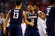 ARLINGTON, TX - APRIL 05: Ryan Boatright #11 and Shabazz Napier #13 of the Connecticut Huskies celebrate against the Florida Gators during the NCAA Men's Final Four Semifinal at AT&T Stadium on April 5, 2014 in Arlington, Texas. (Photo by Tom Pennington/