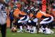 DENVER, CO - SEPTEMBER 23: Center Manny Ramirez #66 of the Denver Broncos prepares to snap the ball as the Broncos offensive line faces the Oakland Raiders defensive line at Sports Authority Field at Mile High on September 23, 2013 in Denver, Colorado.