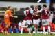 LONDON, ENGLAND - APRIL 06: Guy Demel (C) of West Ham celebrates with teammates Winston Reid (2nd R) and James Tomkins (R) after scoring a goal to level the scores at 1-1 during the Barclays Premier League match between West Ham United and Liverpool at B