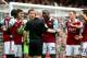 LONDON, ENGLAND - APRIL 06: Goalkeeper Adrian of West Ham and teammates remonstrate with referee Anthony Taylor after conceding a penalty for bringing down Jon Flanagan of Liverpool during the Barclays Premier League match between West Ham United and Liv