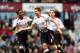 LONDON, ENGLAND - APRIL 06: Steven Gerrard (C)of Liverpool celebrates with teammate Raheem Sterling (L) after scoring the opening goal from the penalty spot during the Barclays Premier League match between West Ham United and Liverpool at Boleyn Ground o