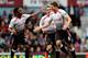 LONDON, ENGLAND - APRIL 06: Steven Gerrard (C)of Liverpool celebrates with teammate Raheem Sterling (L) after scoring the opening goal from the penalty spot during the Barclays Premier League match between West Ham United and Liverpool at Boleyn Ground o