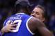 INDIANAPOLIS, IN - MARCH 30: head coach John Calipari of the Kentucky Wildcats celebrates with Julius Randle #30 after defeating the Michigan Wolverines 75 to 72 in the midwest regional final of the 2014 NCAA Men's Basketball Tournament at Lucas Oil Stad