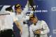 SAKHIR, BAHRAIN - APRIL 06: Race winner Lewis Hamilton (R) of Great Britain and Mercedes GP and second placed team mate Nico Rosberg (L) of Germany and Mercedes GP celebrate on the podium following the Bahrain Formula One Grand Prix at the Bahrain Intern