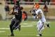 LUBBOCK, TX - NOVEMBER 2: Jace Amaro #22 of the Texas Tech Red Raiders runs away from the Oklahoma State Cowboy defense during game action on November 2, 2013 at AT&T Jones Stadium in Lubbock, Texas. Oklahoma State won the game 52-34. (Photo by John Weast