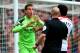 LONDON, ENGLAND - APRIL 06: Goalkeeper Adrian of West Ham remonstrates with referee Anthony Taylor after he concedes a penalty for bringing down Jon Flanagan of Liverpool during the Barclays Premier League match between West Ham United and Liverpool at B