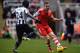 NEWCASTLE UPON TYNE, ENGLAND - DECEMBER 14: Cheick Tiote of Newcastle United tackles Luke Shaw of Southampton during the Barclays Premier League match between Newcastle United and Southampton at St James' Park on December 14, 2013 in Newcastle upon Tyne,