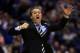 INDIANAPOLIS, IN - MARCH 30: Head coach John Calipari of the Kentucky Wildcats shouts to his players against the Michigan Wolverines during the midwest regional final of the 2014 NCAA Men's Basketball Tournament at Lucas Oil Stadium on March 30, 2014 in