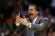 INDIANAPOLIS, IN - MARCH 28: Head coach John Calipari of the Kentucky Wildcats shouts to his team against the Louisville Cardinals during the regional semifinal of the 2014 NCAA Men's Basketball Tournament at Lucas Oil Stadium on March 28, 2014 in Indian