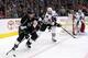 LOS ANGELES, CA - FEBRUARY 03: Justin Williams #14 of the Los Angeles Kings plays the puck around the net as Michal Rozsival #32 of the Chicago Blackhawks tries to defend the play in the second period during the NHL game at Staples Center on February 3,