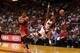 MIAMI, FL - APRIL 02: Toney Douglas #0 of the Miami Heat is fouled by Jeff Adrien #12 of the Milwaukee Bucks during a game at American Airlines Arena on April 2, 2014 in Miami, Florida. NOTE TO USER: User expressly acknowledges and agrees that, by downlo