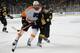 BOSTON, MA - APRIL 5: Andrej Meszaros #41 of the Boston Bruins shoots the puck against Zac Rinaldo #36 of the Philadelphia Flyers at the TD Garden on April 5, 2014 in Boston, Massachusetts. (Photo by Brian Babineau/NHLI via Getty Images)