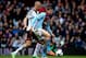 BIRMINGHAM, ENGLAND - APRIL 05: Grant Holt (R) of Aston Villa holds off pressure from Brede Hangeland of Fulham during the Barclays Premier League match between Aston Villa and Fulham at Villa Park on April 5, 2014 in Birmingham, England. (Photo by Ben H