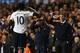 Salutes you, sir: Sherwood and Chris Ramsey celebrate with Adebayor after he put Spurs 4-1 up.