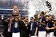 ARLINGTON, TX - APRIL 07: Ryan Boatright #11 of the Connecticut Huskies holds up the trophy after defeating the Kentucky Wildcats 60-54 in the NCAA Men's Final Four Championship at AT&T Stadium on April 7, 2014 in Arlington, Texas. (Photo by Jamie Squire