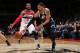 WASHINGTON, DC - MARCH 5: Trey Burke #3 of the Washington Wizards passes the ball against John Wall #2 of the Utah Jazz during the game at the Verizon Center on March 5, 2014 in Washington, DC. NOTE TO USER: User expressly acknowledges and agrees that, by