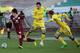 KAZAN, RUSSIA - MARCH 30: Sardar Azmoun (L) of FC Rubin Kazan is challenged by Azim Fatullayev of FC Rostov Rostov-on-Don during the Russian Football League Championship match between FC Rubin Kazan and FC Rostov Rostov-on-Don at the Rubin Stadium on Ma