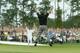 AUGUSTA, GA - APRIL 11: Phil Mickelson jumps in the air after sinking his birdie putt to win the Masters by one shot on the 18th green during the final round of the Masters at the Augusta National Golf Club on April 11, 2004 in Augusta, Georgia. (Photo