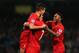 MANCHESTER, ENGLAND - DECEMBER 26: Luis Suarez (C) and Raheem Sterling (R) of Liverpool congratulate goalscorer Philippe Coutinho during the Barclays Premier League match between Manchester City and Liverpool at Etihad Stadium on December 26, 2013 in Man