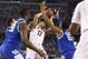 Apr 7, 2014; Arlington, TX, USA; Connecticut Huskies guard Shabazz Napier (13) is trapped by Kentucky Wildcats guard Andrew Harrison (5), James Young (1) and Julius Randle (30) in the second half during the championship game of the Final Four in the 2014